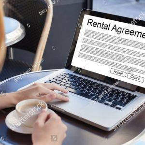 shutter stock for services_0003_stock-photo-rental-agreement-rent-a-car-or-house-woman-reading-tenancy-contract-on-the-s